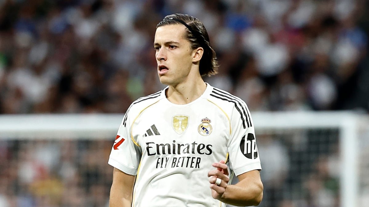 Real Madrid's Andri Lucas Gudjohnsen in white kit on the field. Emirates Fly Better.